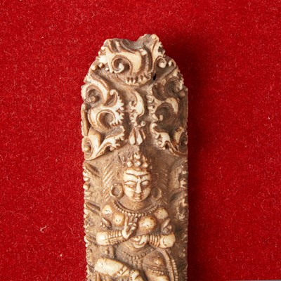 Lot 153 - Two framed collections of Tibetan carved bone apron ornaments 藏传佛教法衣骨片两套