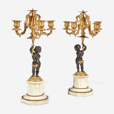 Lot 22 - A Pair of Louis XVI Style Gilt and Patinated Bronze Candelabra