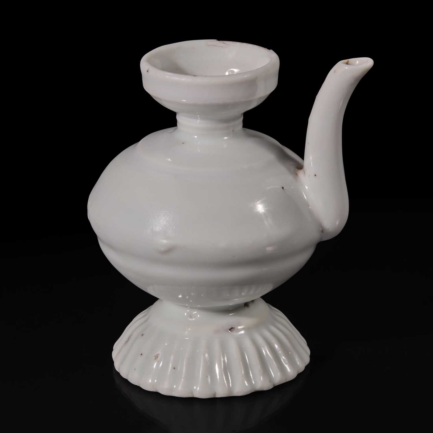 Lot 9 - A small Chinese white glazed porcelain ewer