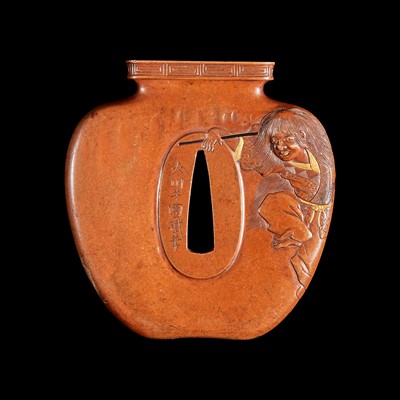 Lot 194 - A Japanese patinated and parcel-gilt metal "Shojo and Wine Jar" Tsuba 日本”猩猩与酒壶“刀镡