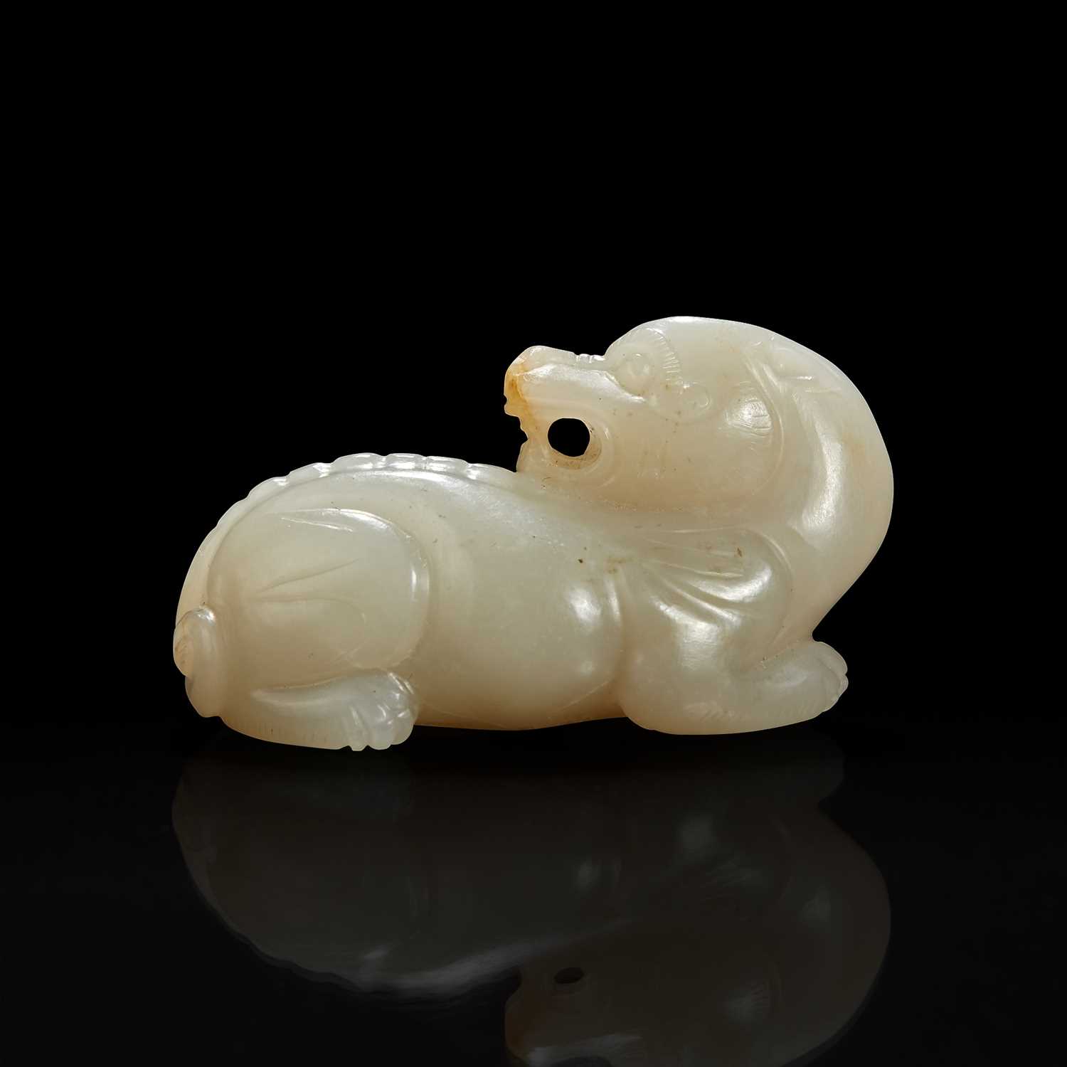 Lot 129 - A Small Chinese carved grayish white jade figure of mythical beast 白玉小瑞兽