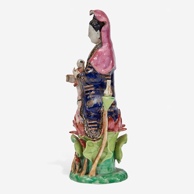Lot 19 - A Chinese export porcelain famille rose-decorated figure of Guanyin and child 粉彩出口瓷观音送子