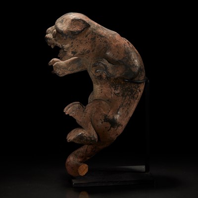 Lot 170 - A carved and painted wood figure of a rampant feline 木雕大猫