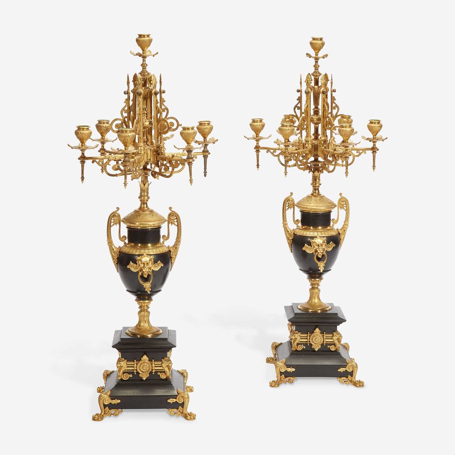 Lot 37 - A Pair of Napoleon III Gilt-Bronze and Black Marble Seven-Light Candelabra
