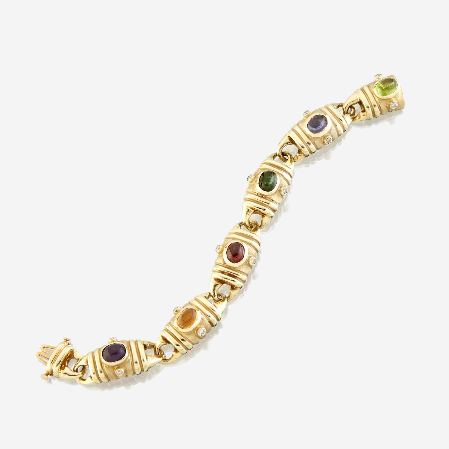Lot 83 - A fourteen karat gold and gem-set bracelet