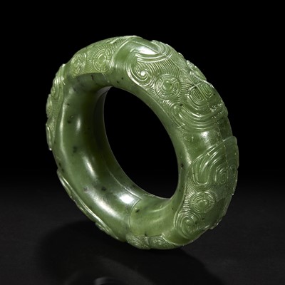 Lot 131 - A Chinese spinach jade double ring 碧玉御题诗蚩尤环