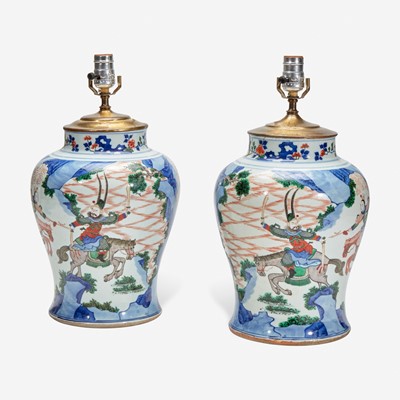 Lot 53 - A pair of large Chinese wucai-decorated porcelain jars, mounted as lamps