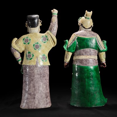 Lot 92 - An unusual pair of large Chinese famille-verte decorated porcelain guardians 五彩门神一对
