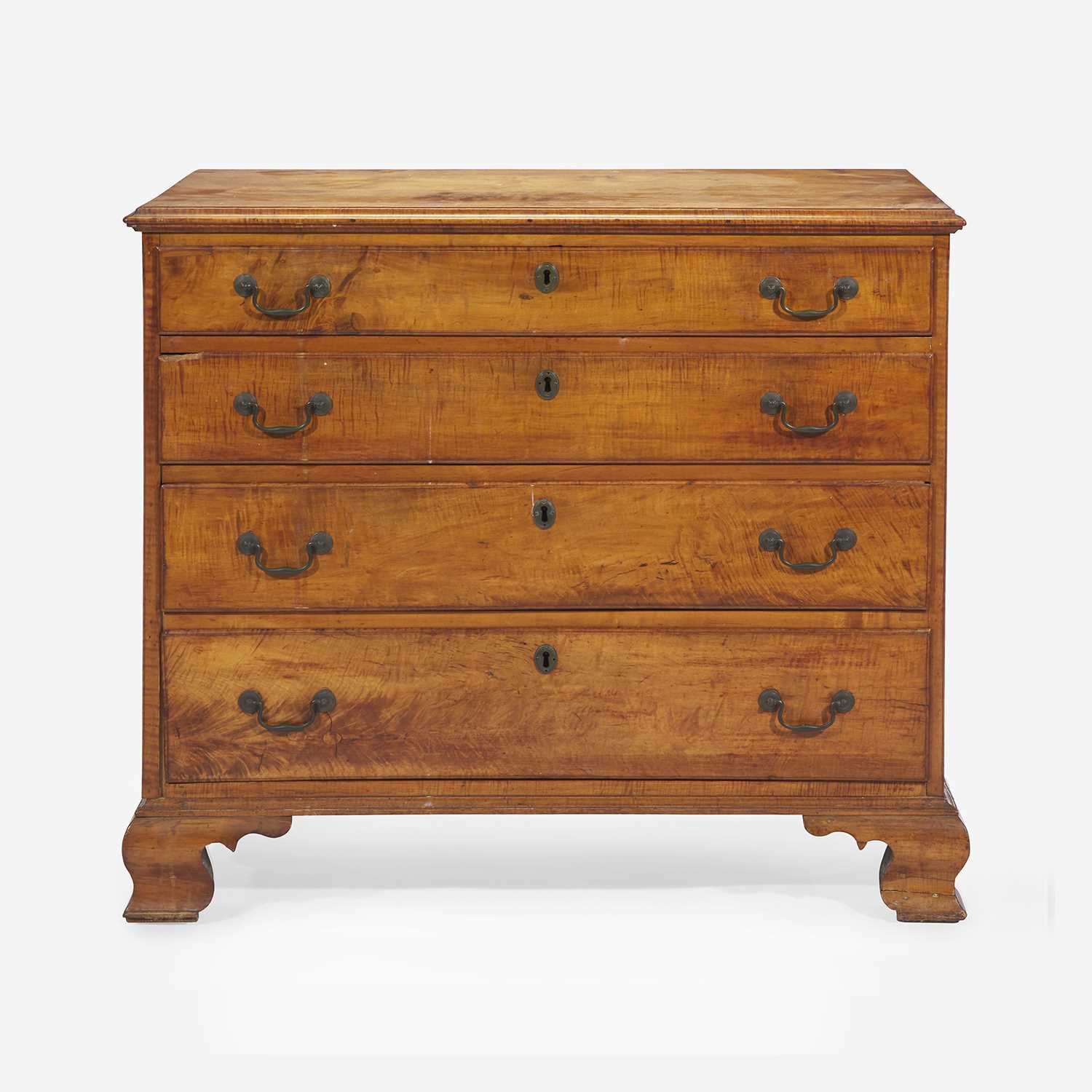 Lot 84 - A Chippendale carved tiger maple chest of drawers