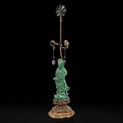 Lot 135 - A Chinese carved green aventurine quartz Guanyin, mounted as a lamp 东陵石雕观音
