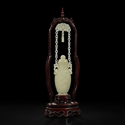 Lot 133 - A Chinese pale celadon jade hanging vase and wood stand 白玉吊瓶