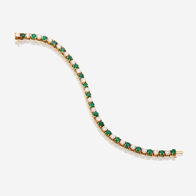 Lot 39 - A diamond, emerald, and fourteen karat gold bracelet