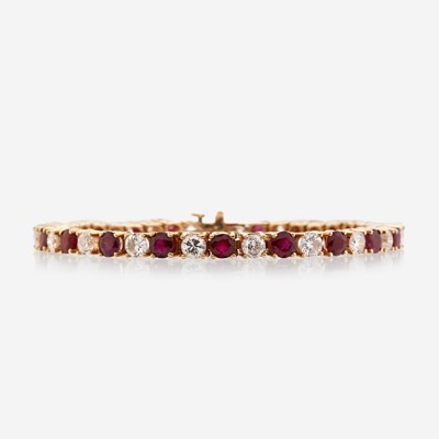 Lot 40 - A diamond, ruby, and fourteen karat gold bracelet