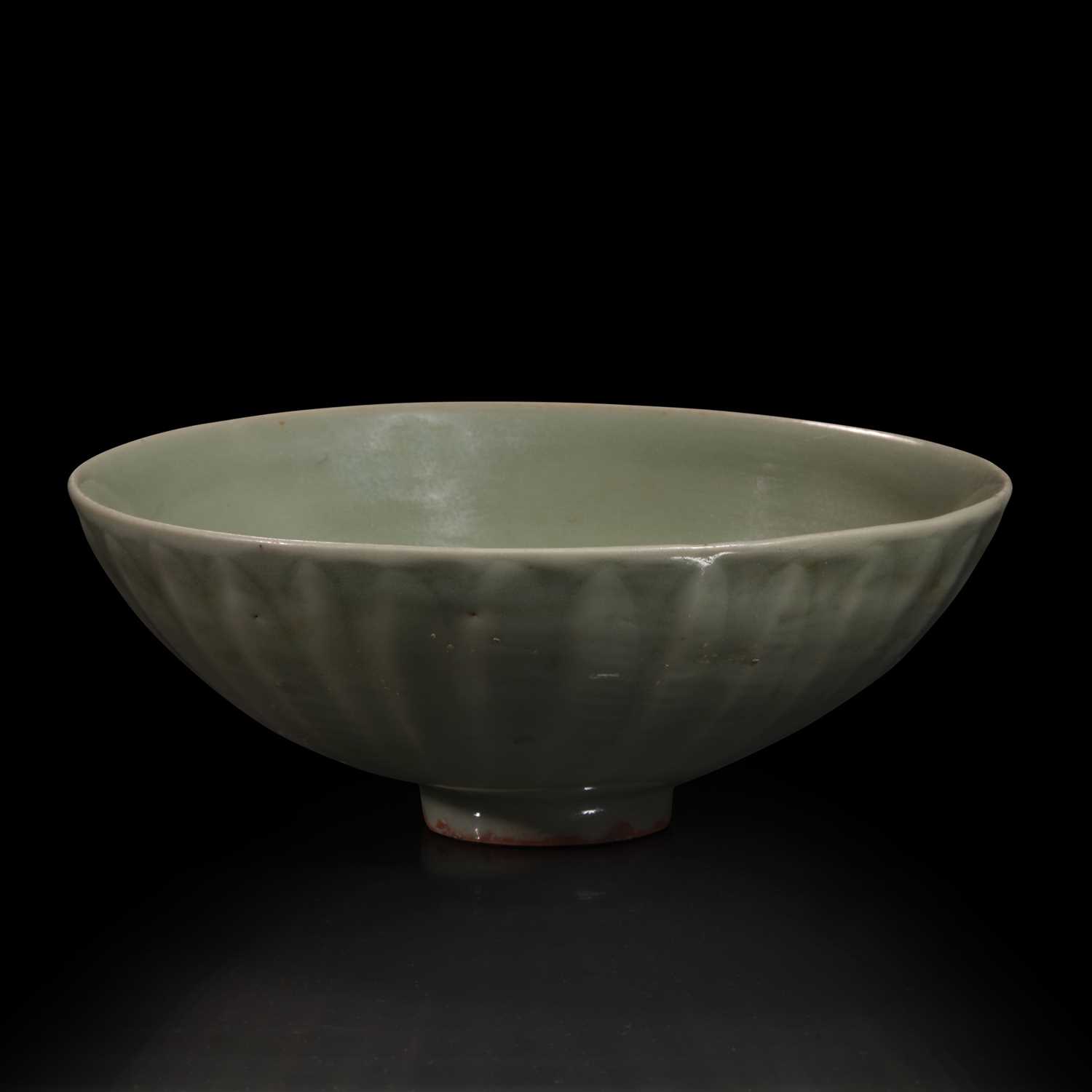 Lot 2 - A Chinese Longquan celadon petal-carved "Lotus" bowl 龙泉窑刻划花碗