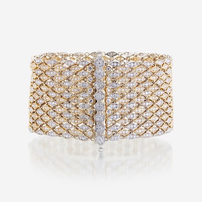Lot 42 - A bicolor fourteen karat gold and diamond bracelet