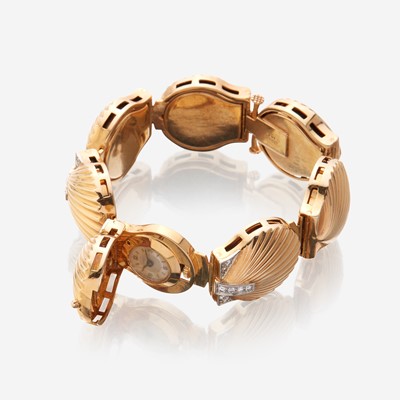 Lot 187 - A fourteen karat gold and diamond bracelet watch, J. Schulz