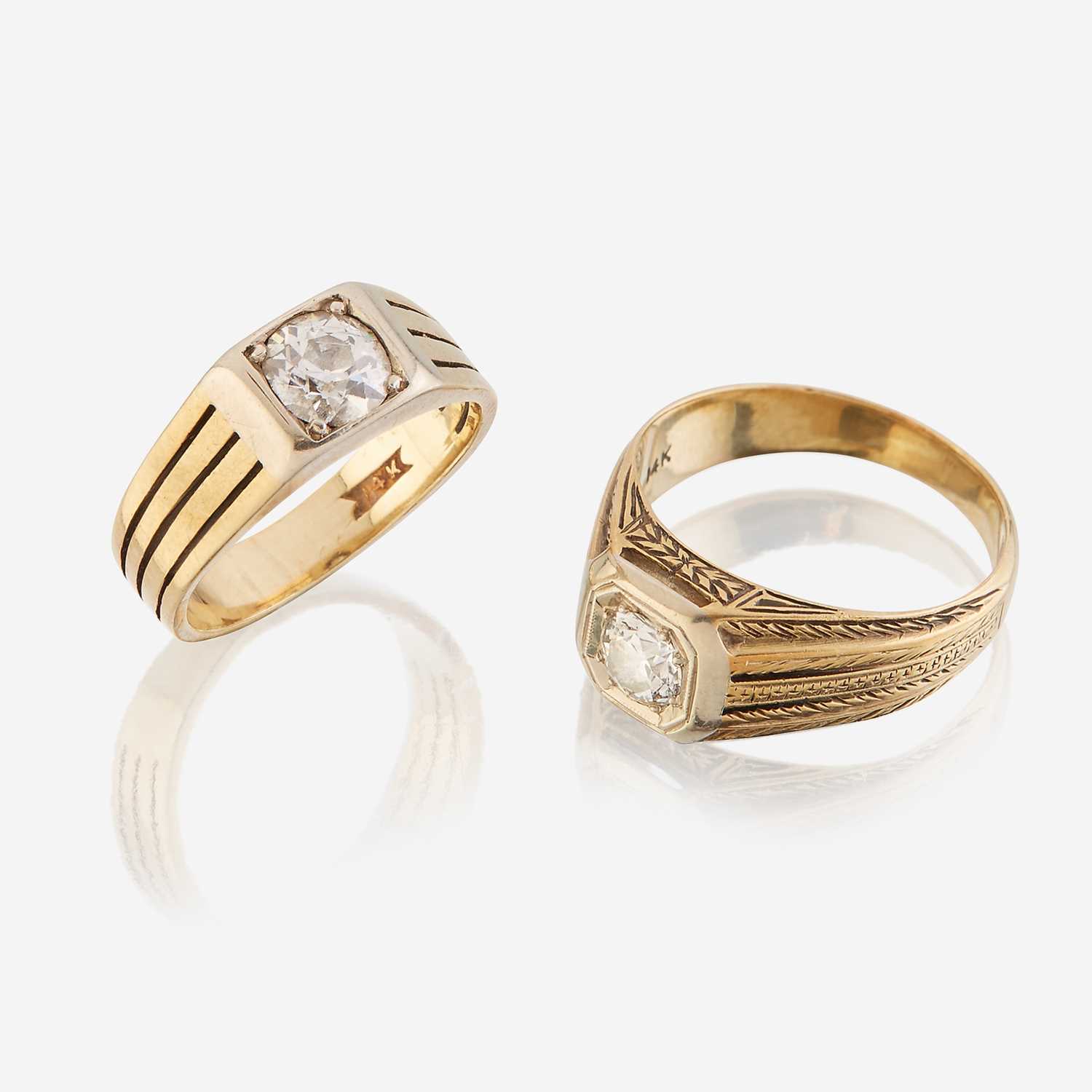 Lot 65 - A pair of fourteen karat gold and diamond rings