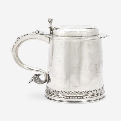 Lot 77 - A silver covered tankard