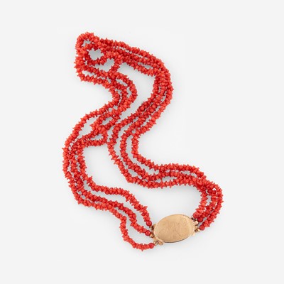 Lot 67 - A gold clasp strung on a coral necklace