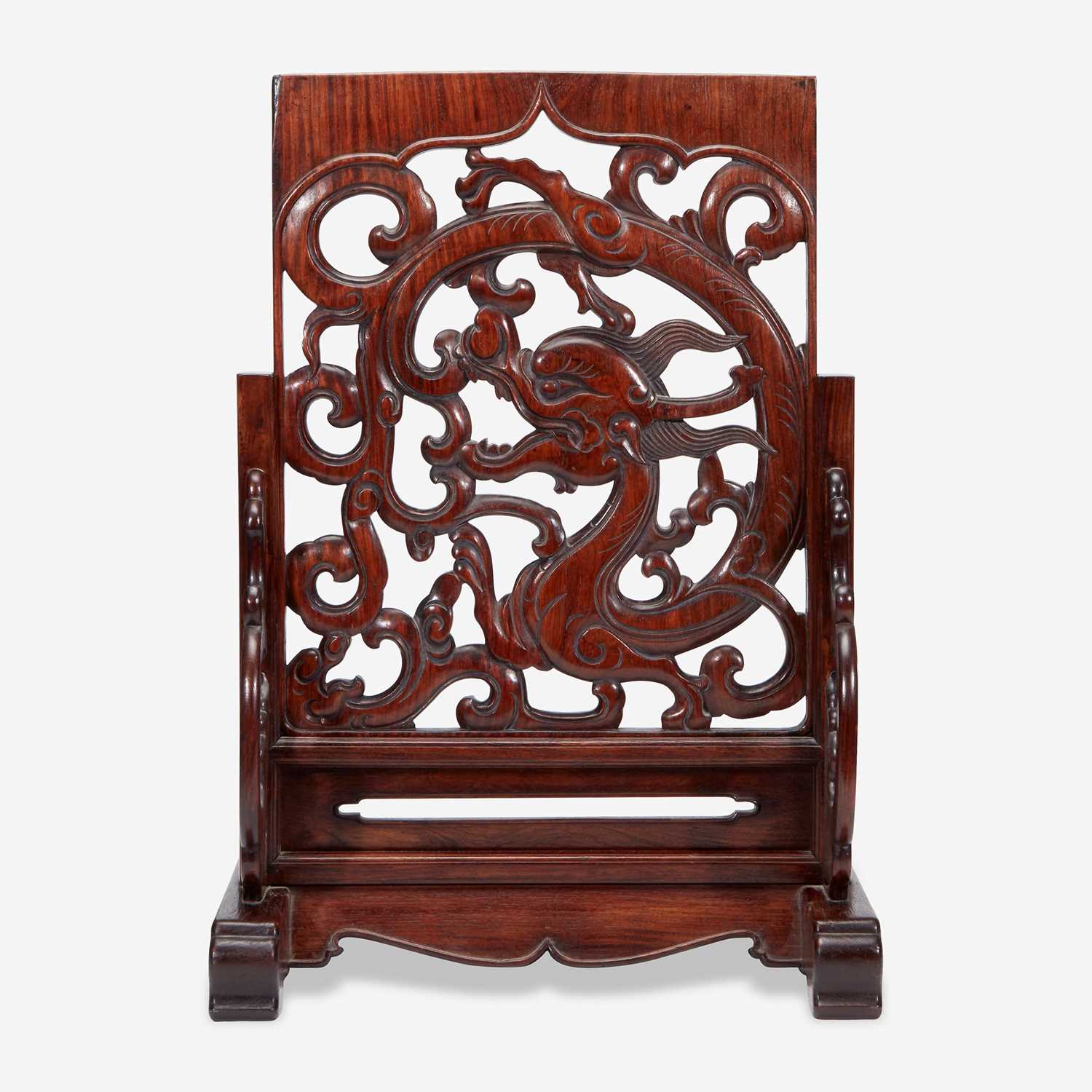 Lot 42 - A Chinese carved and pierced huanghuali "dragon" panel, in later hardwood stand 黄花梨镂雕龙纹木板 后配底座