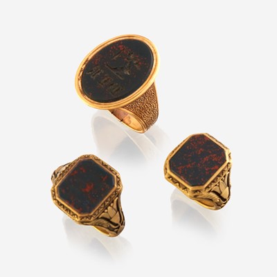 Lot 152 - A collection of three gold and bloodstone men's rings
