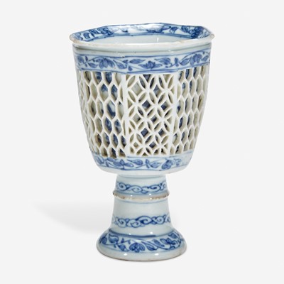 Lot 7 - A Chinese blue and white porcelain reticulated stemmed cup 青花镂空高足杯