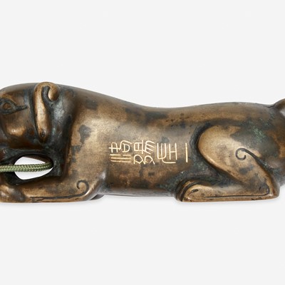 Lot 48 - A Chinese inscribed archaistic bronze "Tiger" tally 嵌金铜虎符