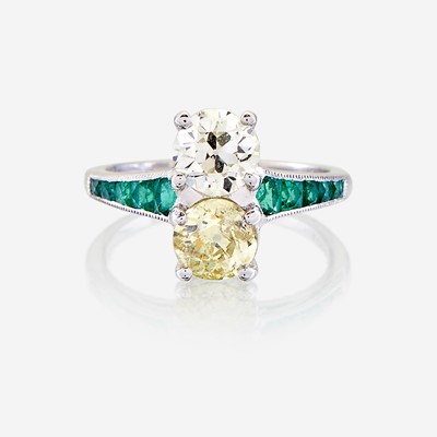 Lot 7 - A fancy yellow diamond, diamond, emerald, and platinum ring