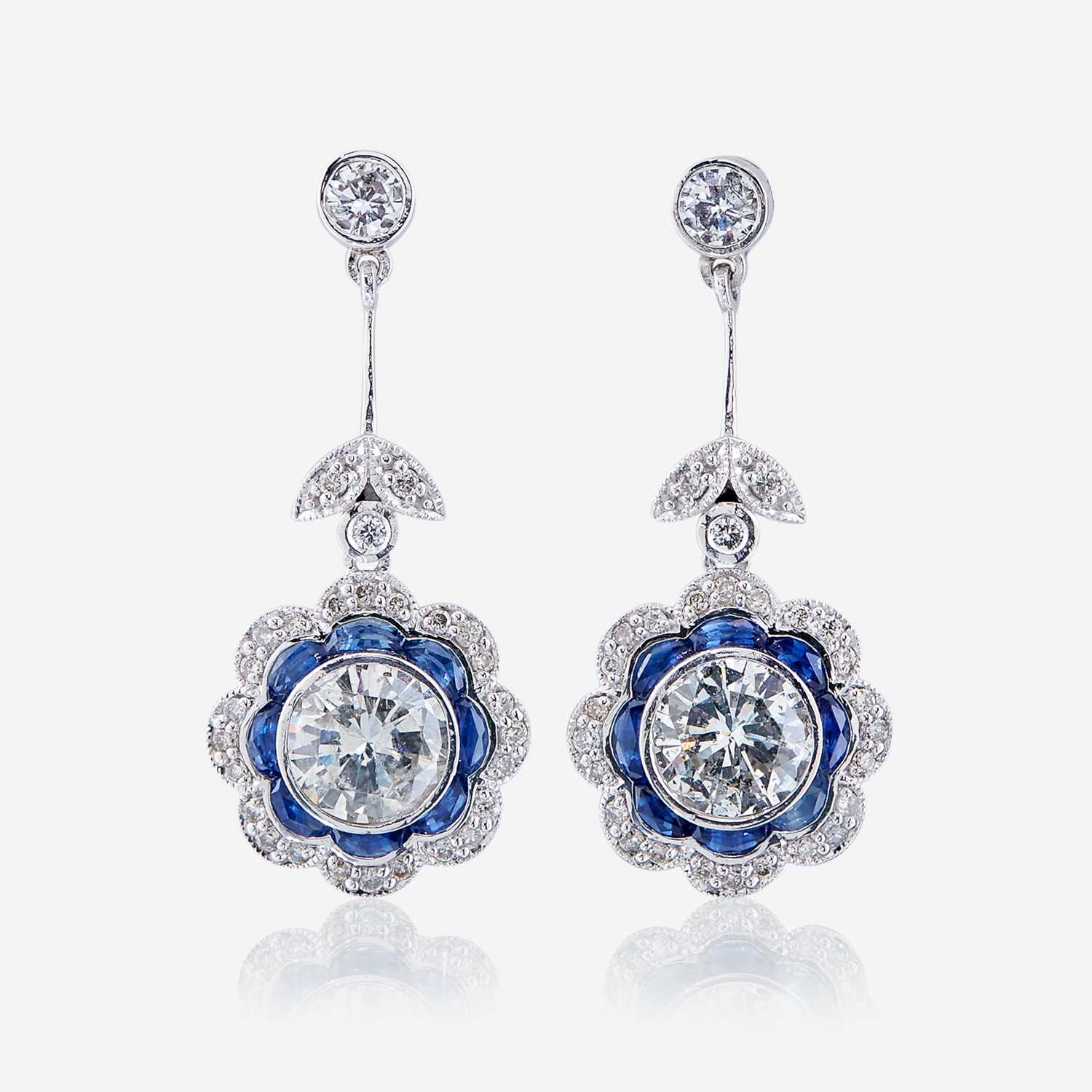 Lot 46 - A pair of diamond, sapphire, and platinum earrings