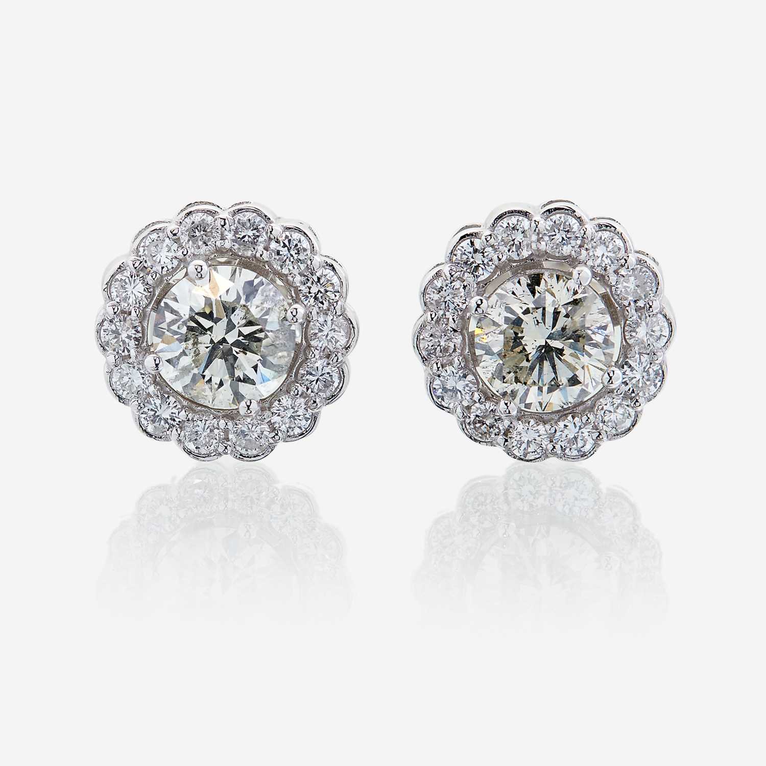 Lot 58 - A pair of diamond and eighteen karat white gold earrings