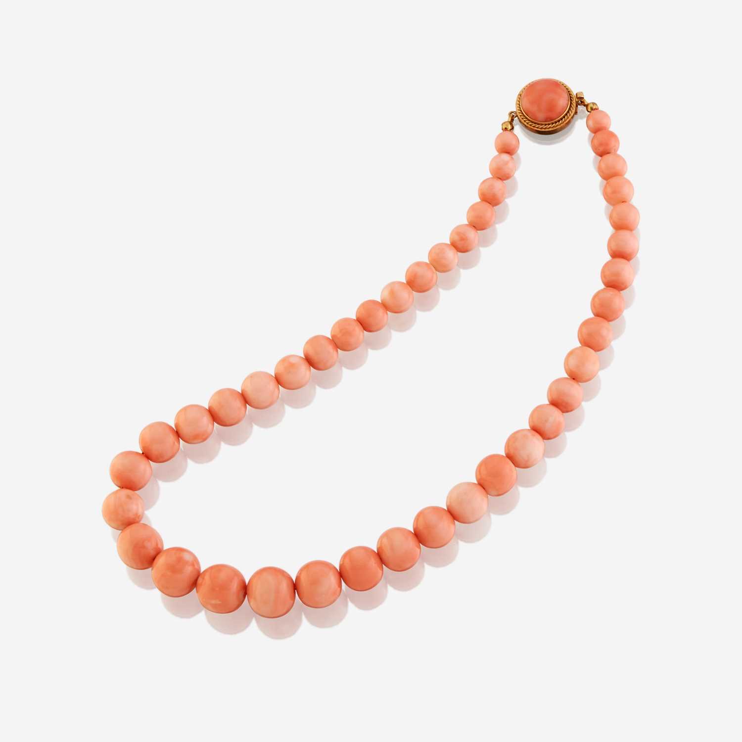 Lot 176 - A coral and eighteen karat gold necklace