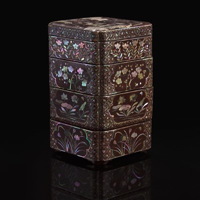 Lot 68 - A Chinese mother of pearl-inlaid four-tier lacquer box 黑漆嵌螺钿四层盒