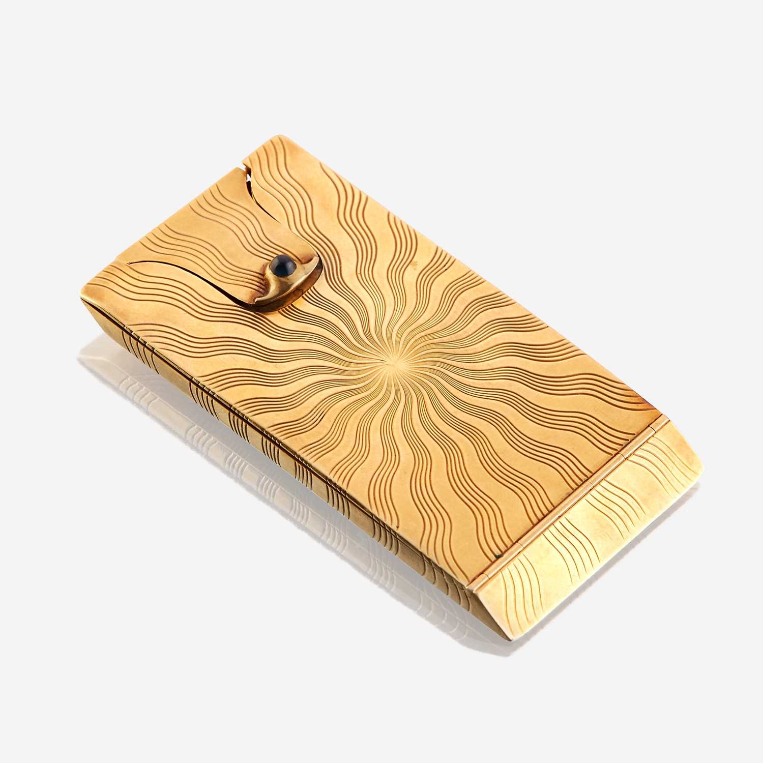 Lot 12 - An eighteen karat gold and sapphire card case, Cartier