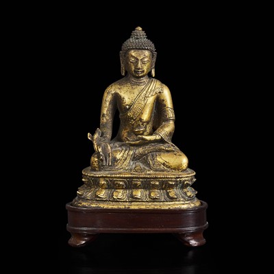 Lot 1 - A Sino-Tibetan gilt bronze figure of Bhaishajyaguru 鎏金铜药师佛造像