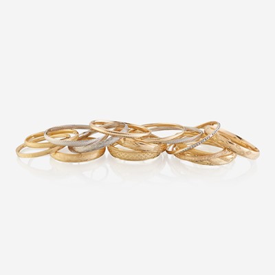 Lot 160 - A collection of sixteen fourteen karat gold bangles