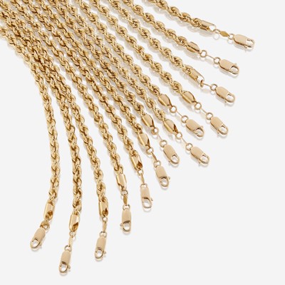 Lot 55 - A collection of thirteen fourteen karat gold necklaces