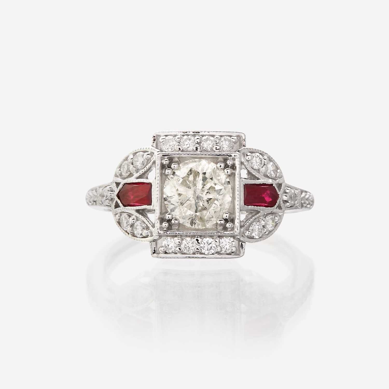 Lot 128 - A diamond, ruby, and eighteen karat white gold ring