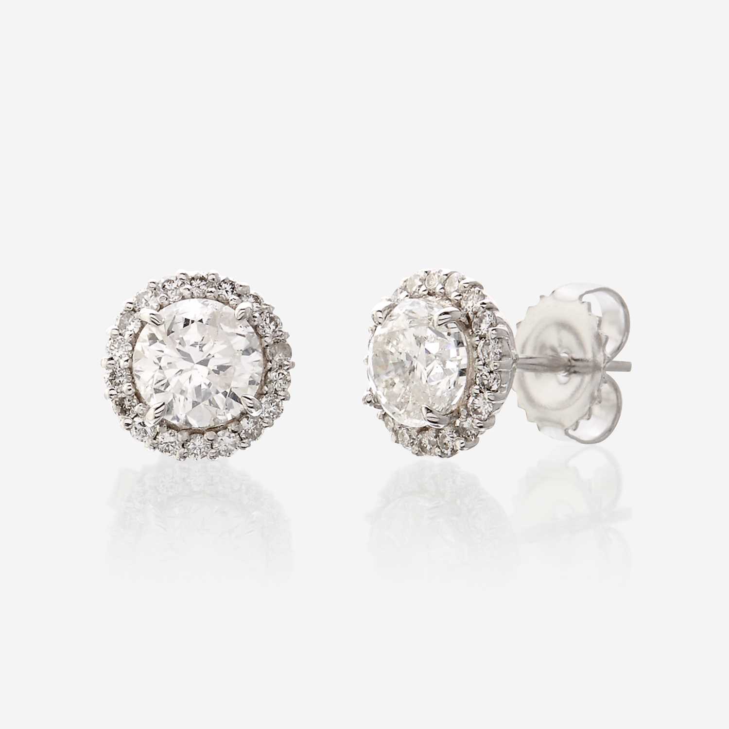 Lot 119 - A pair of diamond and eighteen karat white gold earrings