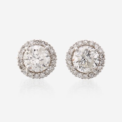 Lot 119 - A pair of diamond and eighteen karat white gold earrings