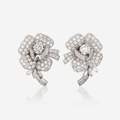 Lot 140 - A pair of diamond and eighteen karat white gold earrings