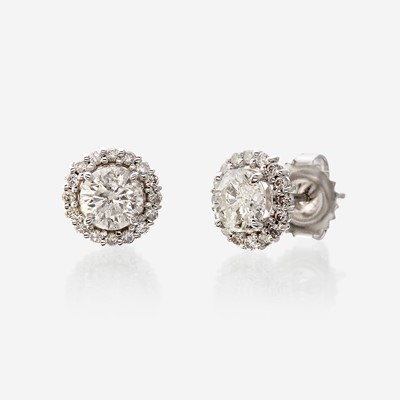 Lot 124 - A pair of diamond and eighteen karat white gold earrings