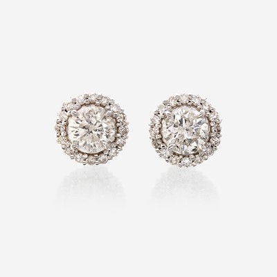 Lot 124 - A pair of diamond and eighteen karat white gold earrings