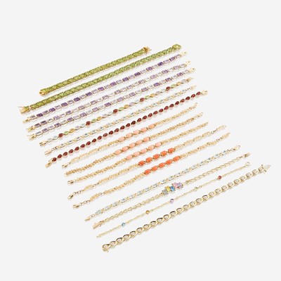 Lot 149 - A collection of seventeen fourteen karat gold and gem-set bracelets