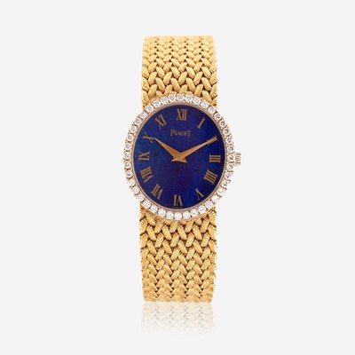 Lot 190 - An eighteen karat gold, lapis lazuli, and diamond bracelet wristwatch, Piaget