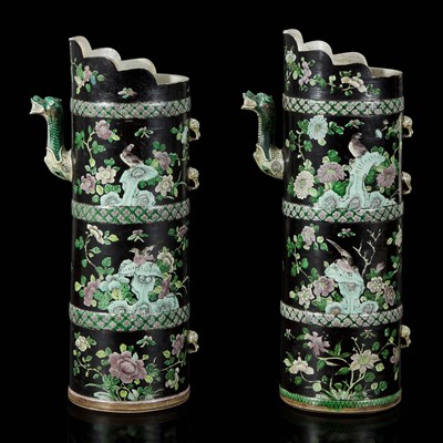 Lot 19 - An associated pair of Chinese famille noir-decorated porcelain ceremonial ewers 黑地瓷胎画珐琅多穆壶两只 或为一对