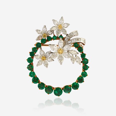 Lot 166 - An emerald, diamond, colored diamond, gold, and platinum pendant/brooch