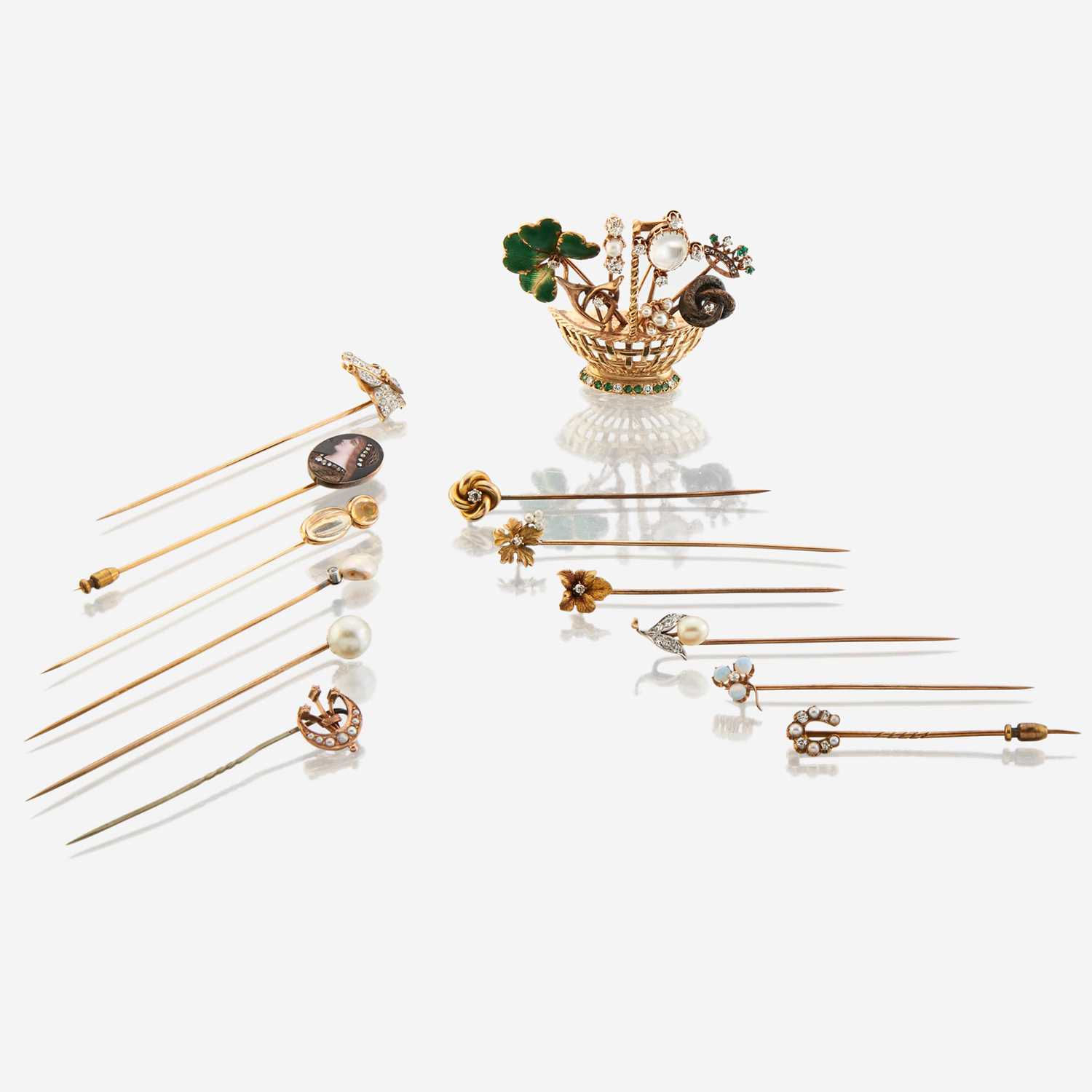Lot 55 - A collection of twelve gold and gem-set stick pins with brooch