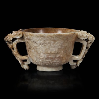 Lot 84 - A Chinese ‘’chicken-bone’’ jade carved libation cup 鸡骨白瓒杯