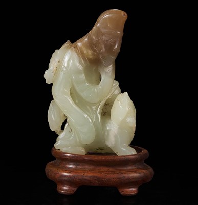 Lot 81 - A rare Chinese jade carving of a foreigner and mythical beast 胡人戏兽玉雕