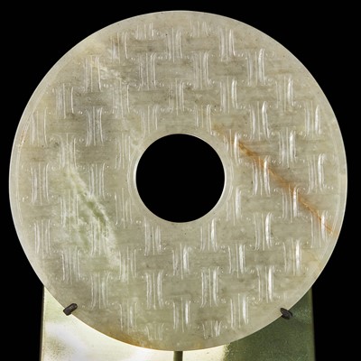 Lot 89 - An unusual archaic style Chinese jade "Bi" disc 双头云纹与蒲纹仿古玉璧一件